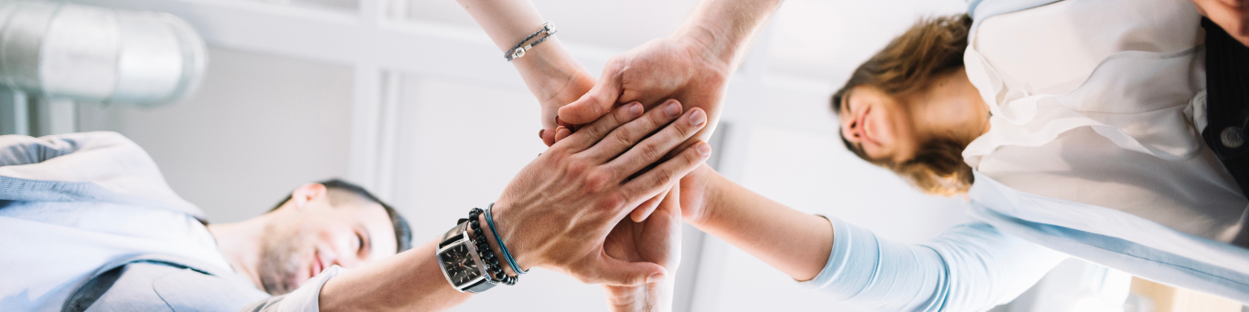 group of people joining hand